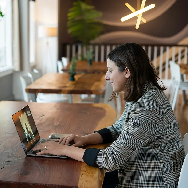 A real estate broker talking to a client via video conference