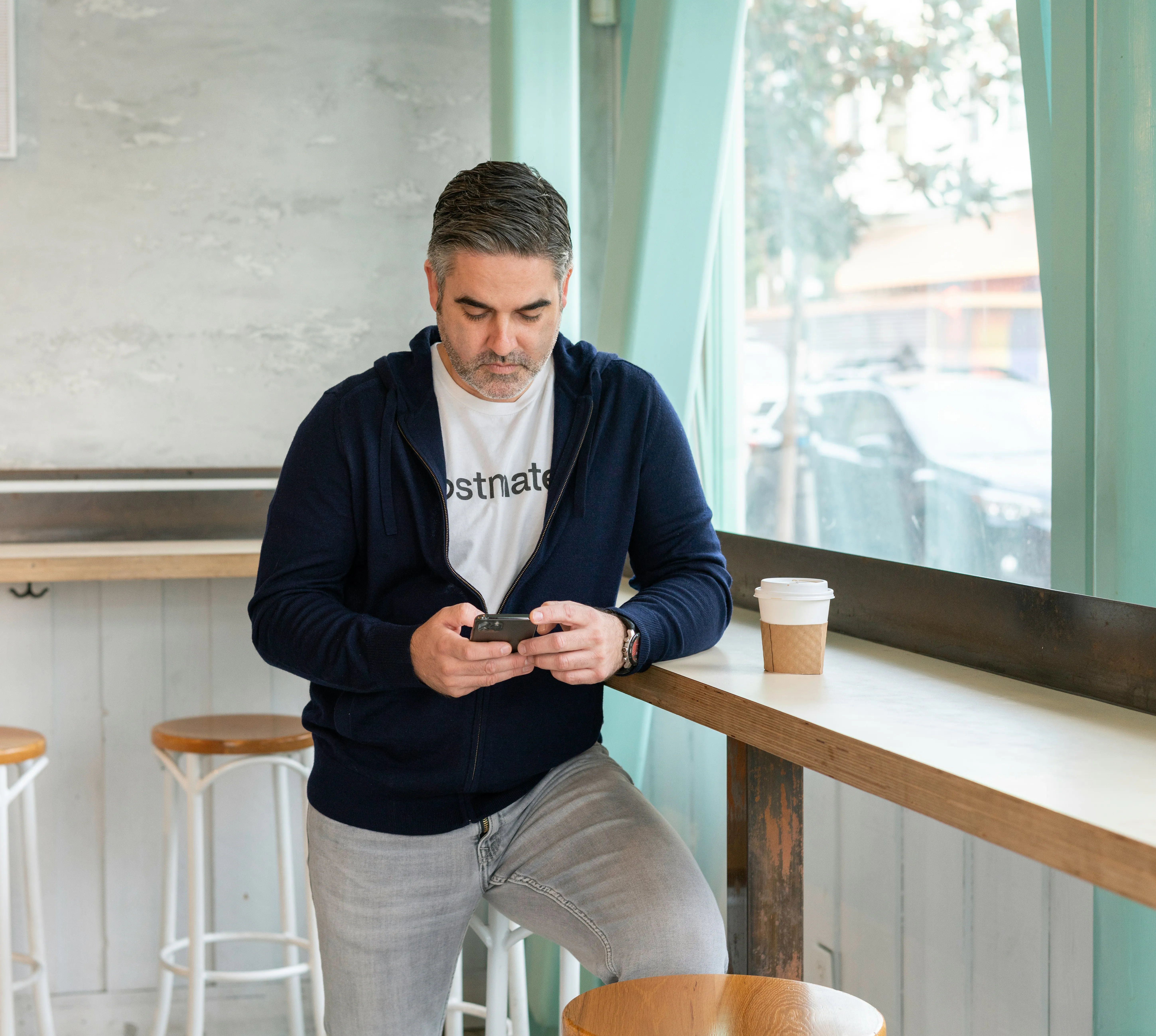 A real estate broker talking to a client on the phone